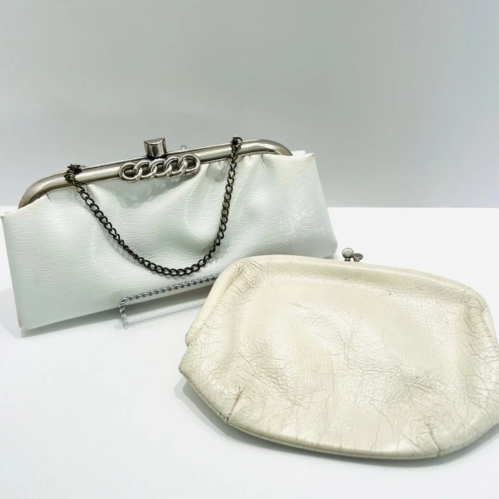 Vintage pair of white leather clutches, one is 70’s with great blk/white lining